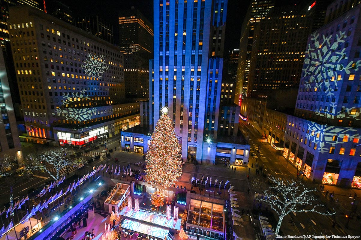 The Rockefeller Center Christmas Tree stands lit, Wednesday, Dec. 2, 2020, in New York. The 75-foot tall Norway spruce is covered with more than 50,000 multi-colored, energy-efficient LED lights.The lit tree will be on display starting Thursday, December 3, through early January 2021 and will also will be livestreamed each day from 8 am to midnight at rockefellercenter.com.  (Diane Bondareff/AP Images for Tishman Speyer)